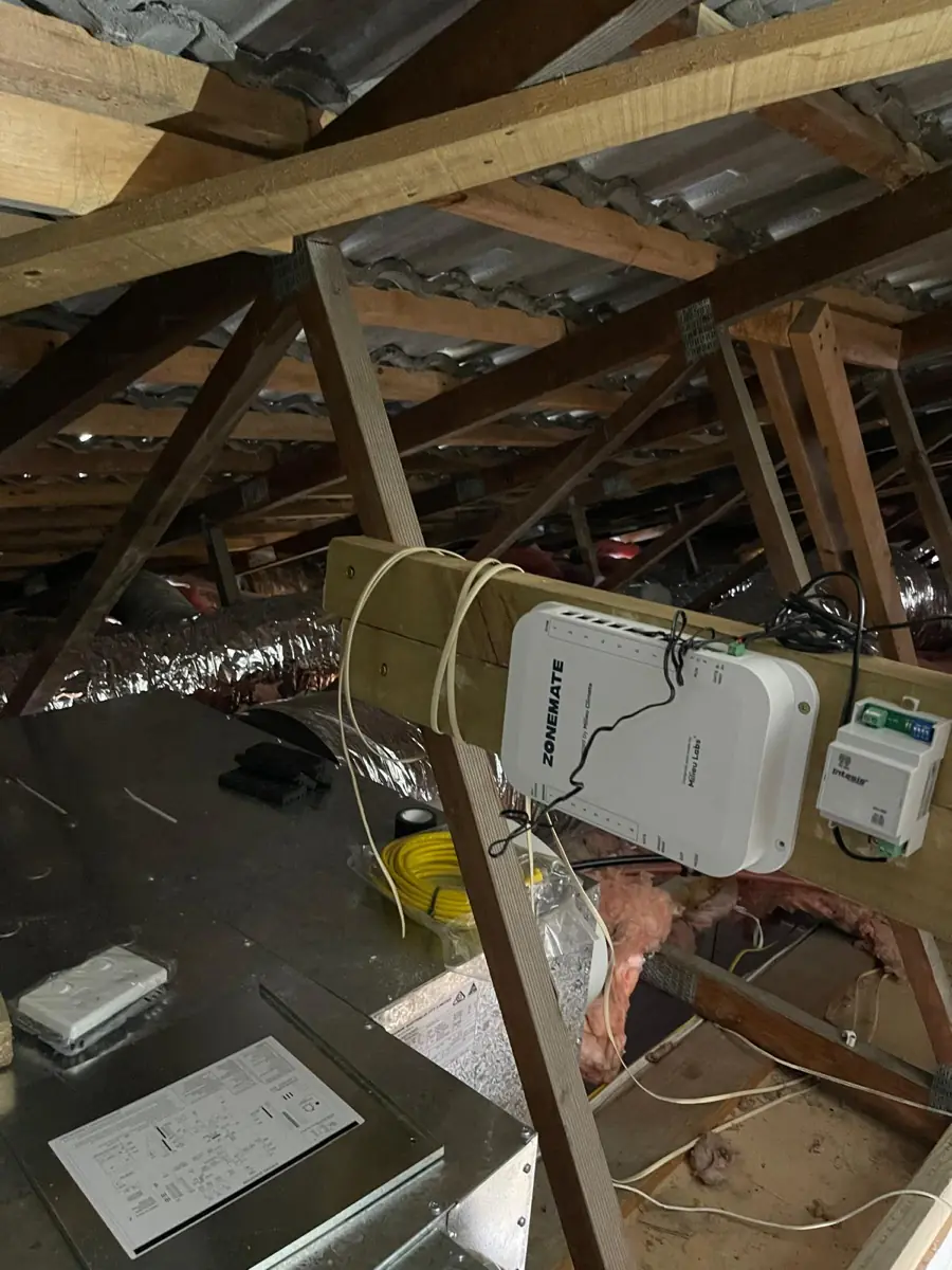 A zone controller for a ducted air conditioning system mounted in a roof space
