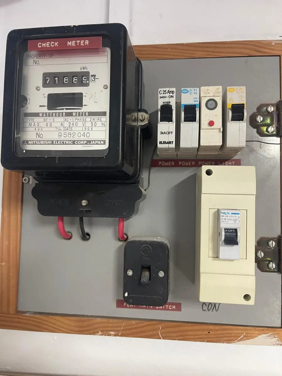 A 1968 Mitsubishi watt-hour meter and original fuse board still in service